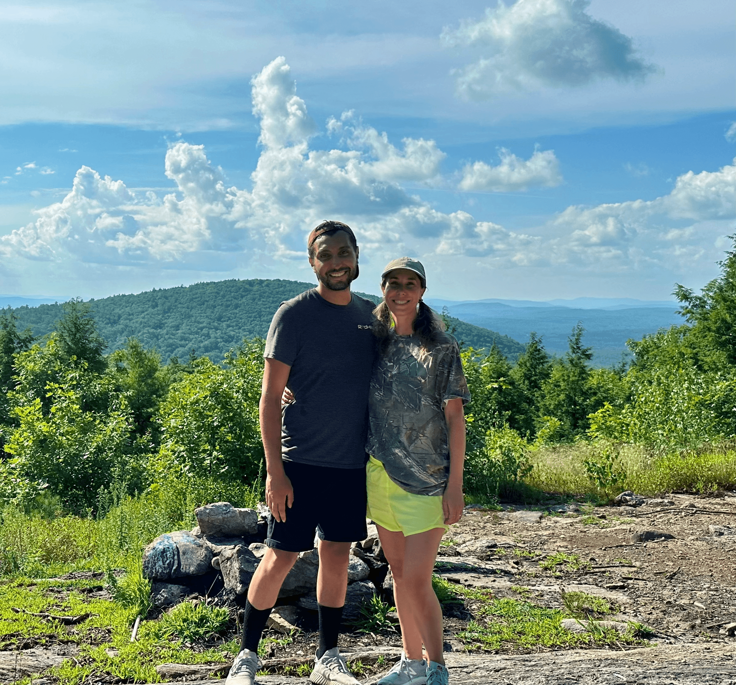 Alex Stokes hiking outdoors with his wife